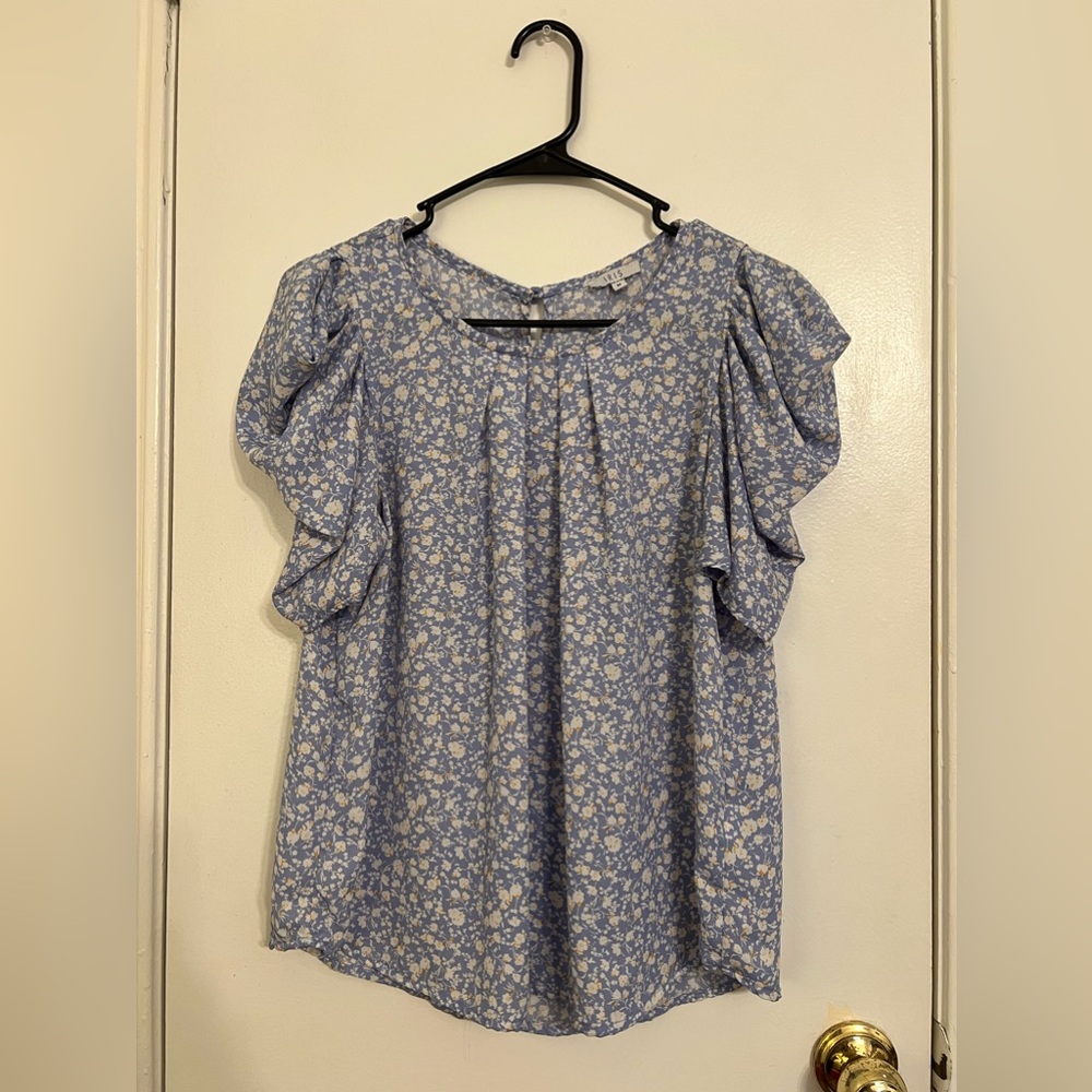 Iris brand blouse, size M, light blue with white and yellow flowers.